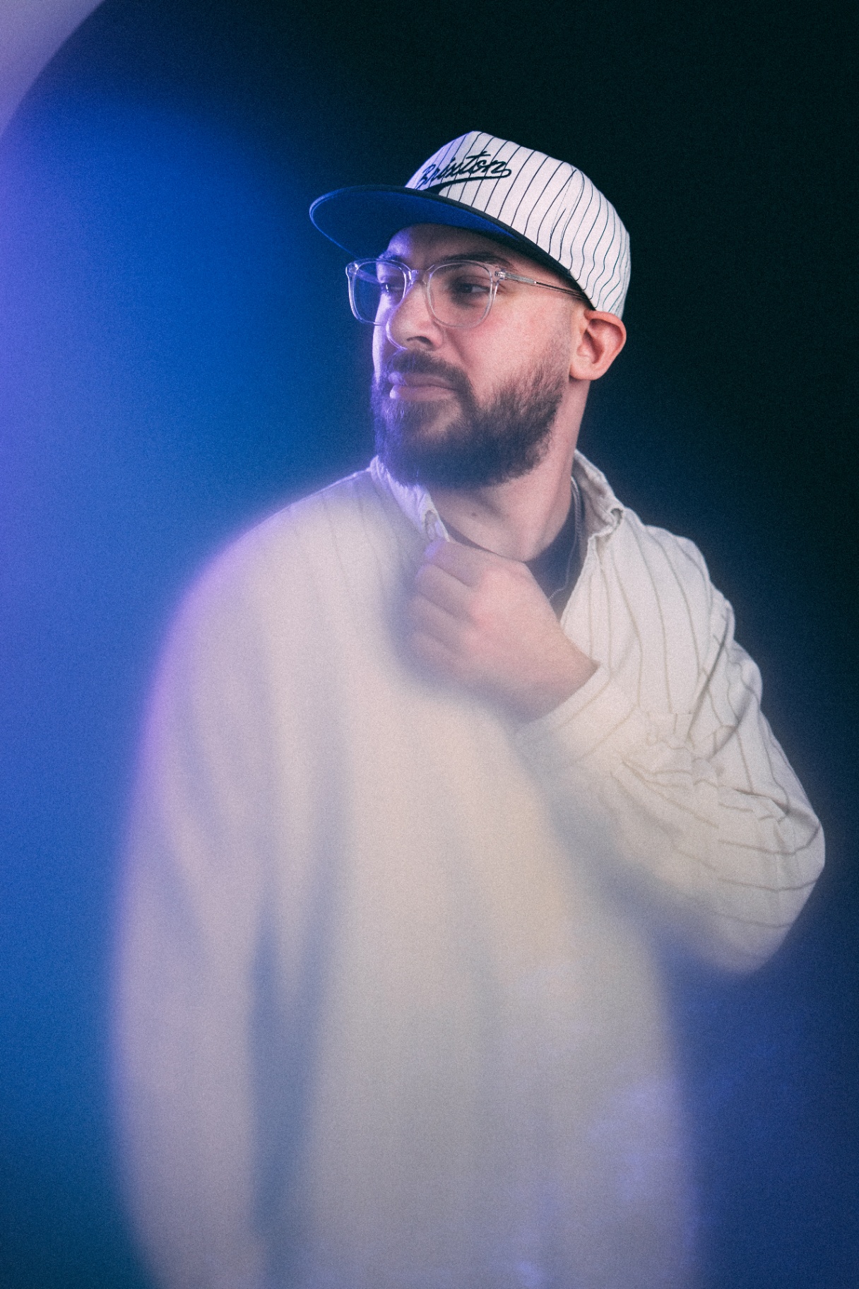 Christian adjusting collar under blue light