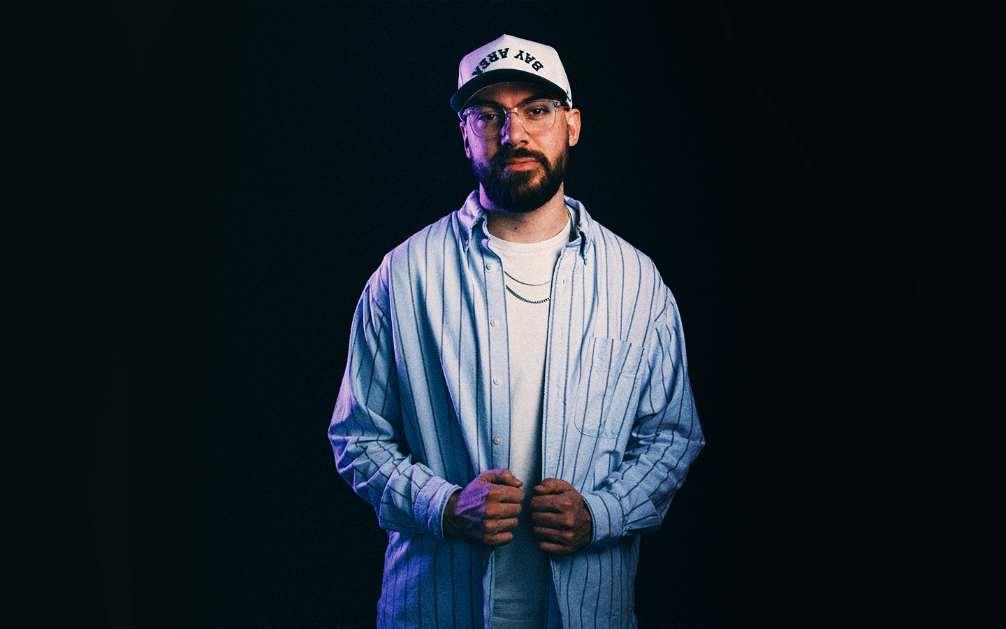 Christian standing in studio lighting